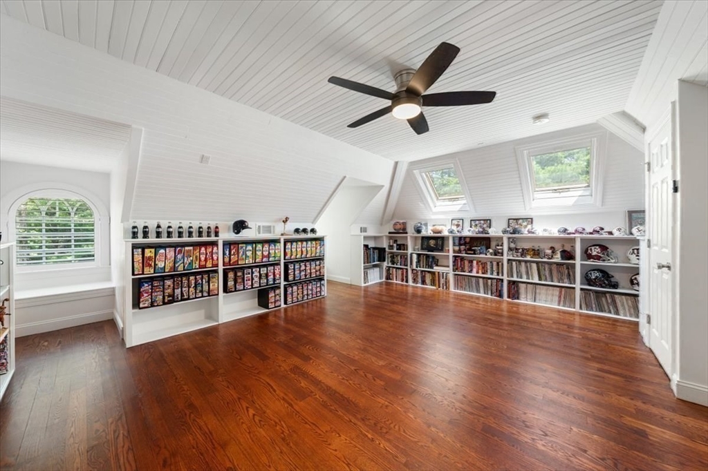 15 A Moccasin Path Natick, MA 01760 - Photo 19 of 42 a view of a livingroom with hardwood floor and a ceiling fan