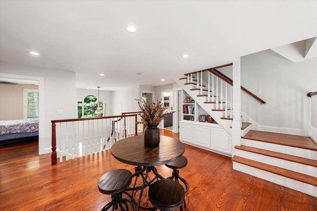 15 A Moccasin Path Natick, MA 01760 - Photo 20 of 42 a view of a dining room with furniture and wooden floor