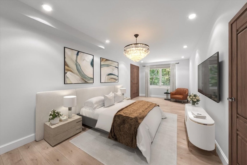 15 A Moccasin Path Natick, MA 01760 - Photo 23 of 42 a spacious bedroom with a bed window and couch