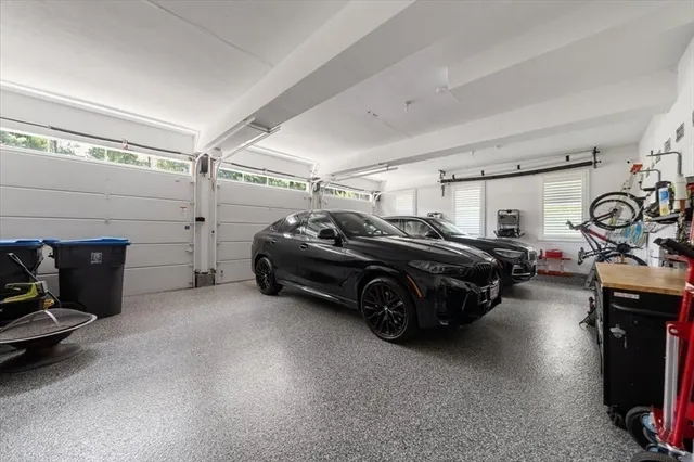 a garage with a car parked and a garage