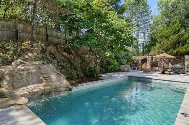 a view of a backyard with a small pool
