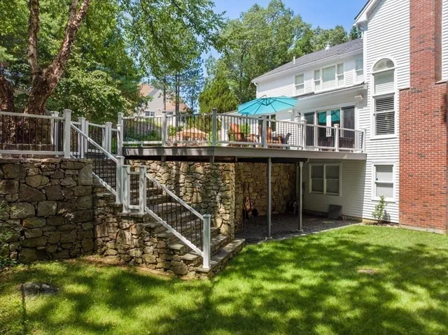 a view of a house with backyard and porch
