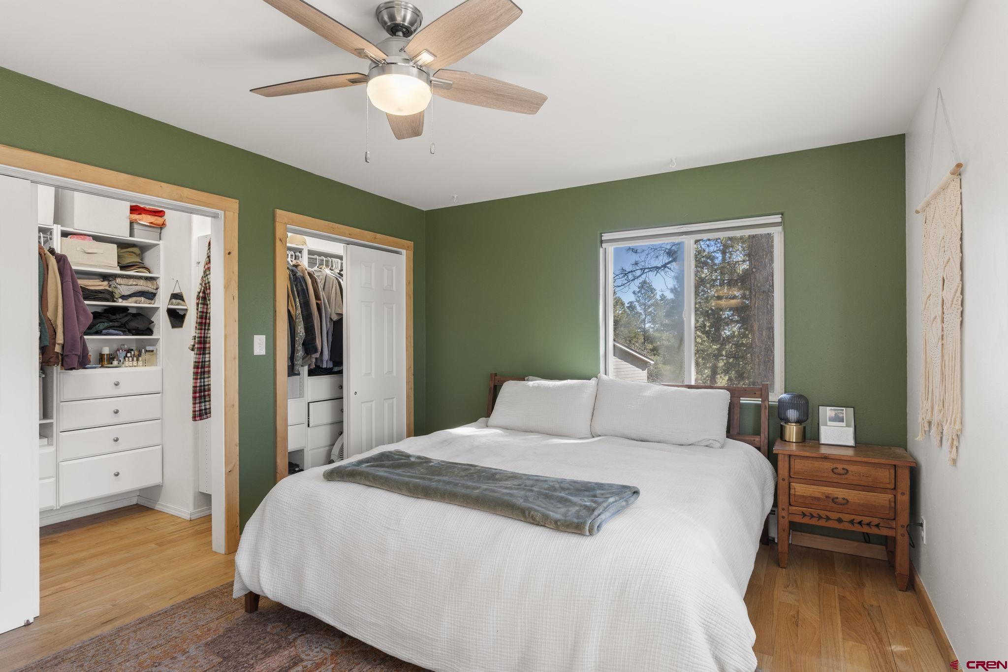 31 Valley View Way Durango, CO 81303 - Photo 11 of 29 a bedroom with a bed and a chandelier