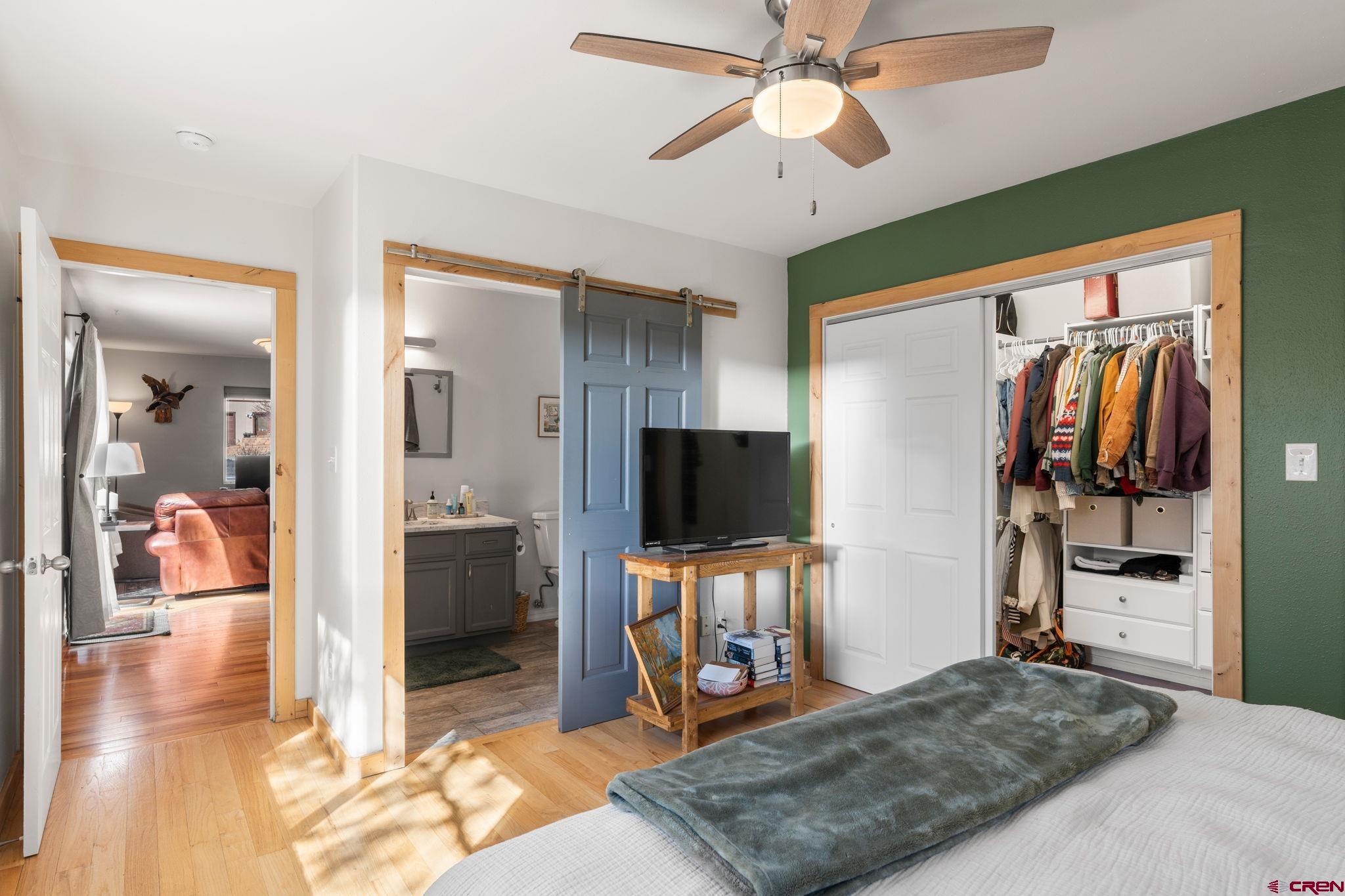 31 Valley View Way Durango, CO 81303 - Photo 12 of 29 a bedroom with furniture and a flat screen tv