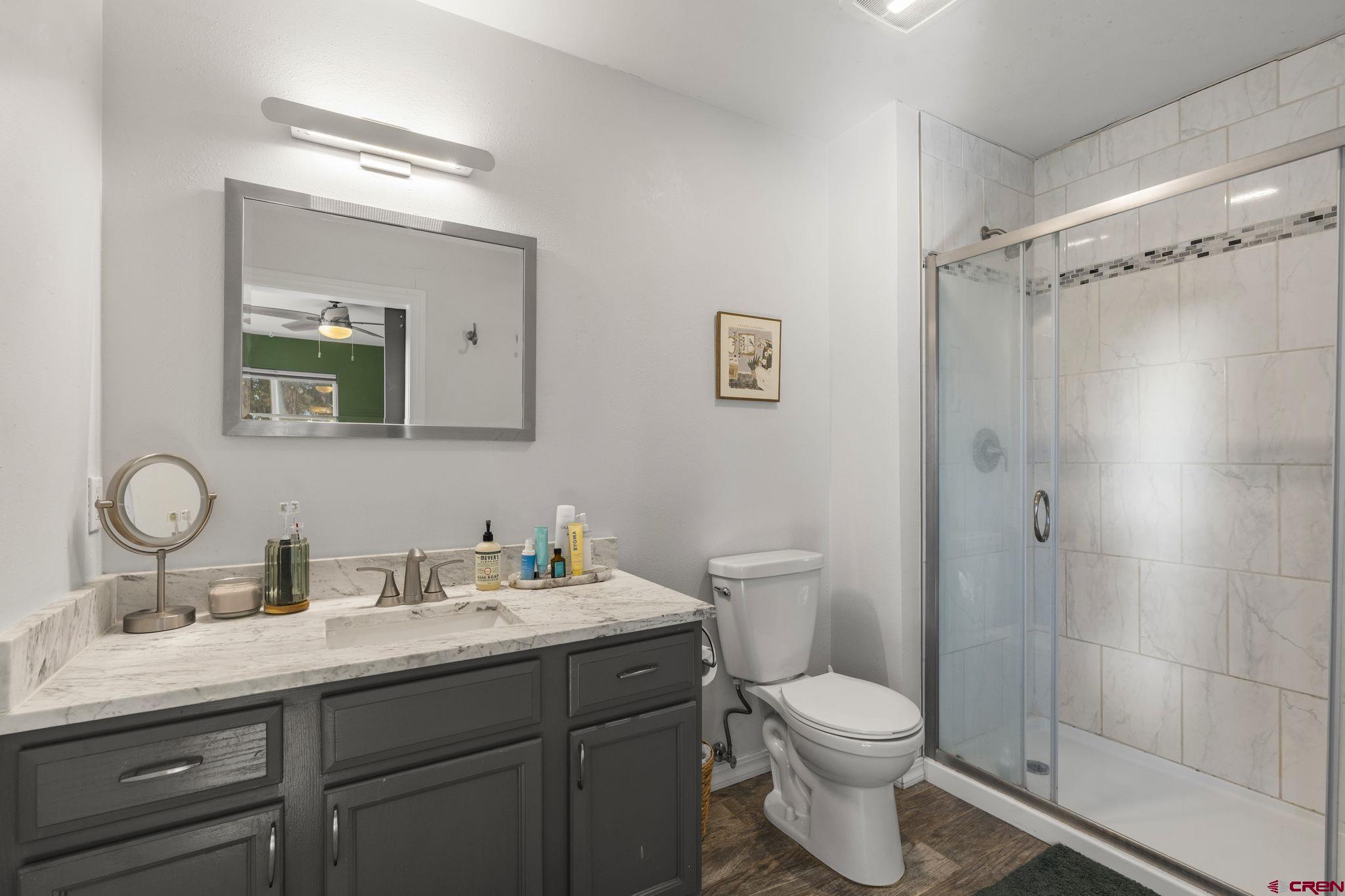 31 Valley View Way Durango, CO 81303 - Photo 15 of 29 a bathroom with a toilet sink and mirror