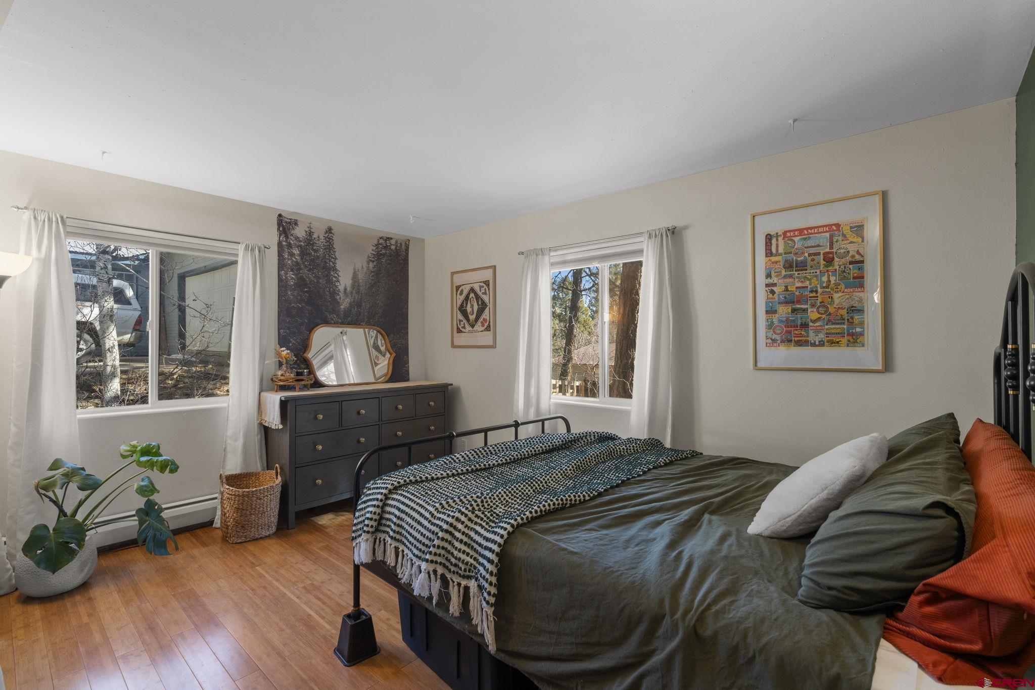 31 Valley View Way Durango, CO 81303 - Photo 19 of 29 a bedroom with a bed and wooden floor