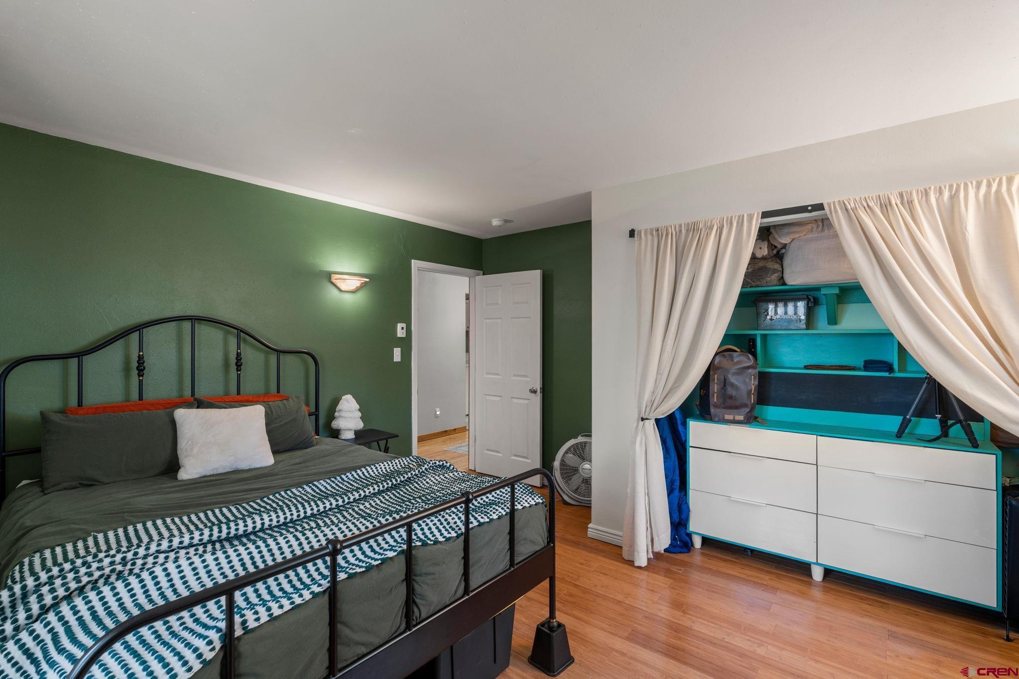 31 Valley View Way Durango, CO 81303 - Photo 20 of 29 a bedroom with bed and wooden floor