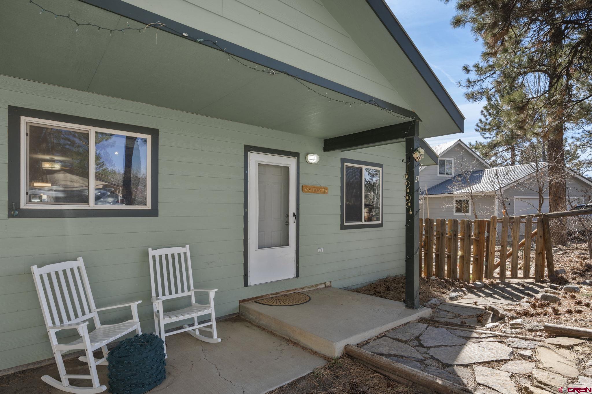 31 Valley View Way Durango, CO 81303 - Photo 25 of 29 a backyard of a house with table and chairs