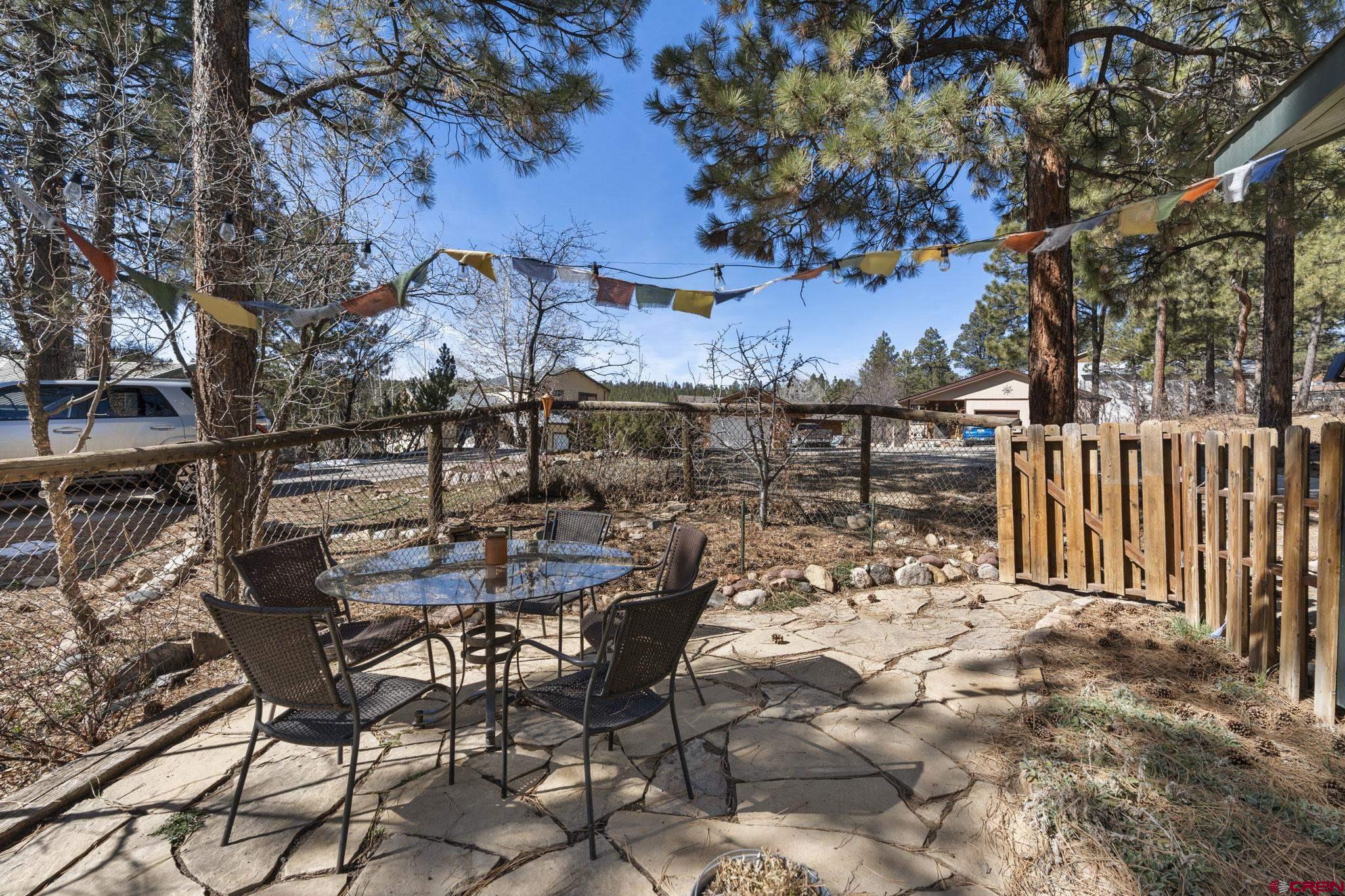 31 Valley View Way Durango, CO 81303 - Photo 27 of 29 a view of a chairs and table in a backyard
