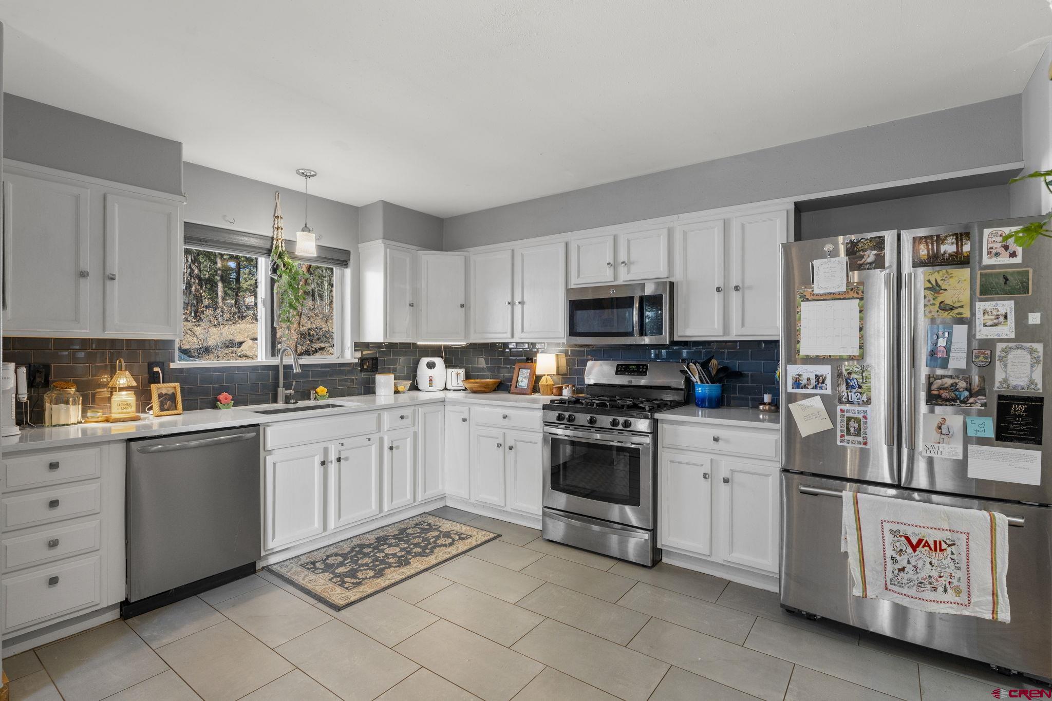 31 Valley View Way Durango, CO 81303 - Photo 10 of 29 a kitchen with cabinets appliances and a window