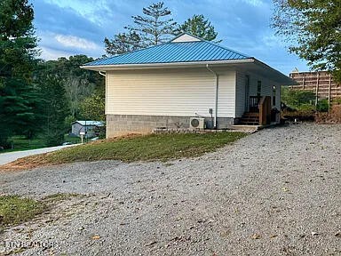 309 Hobson Road Kingston, TN 37763 - Photo 3 of 12 a front view of a house with a yard