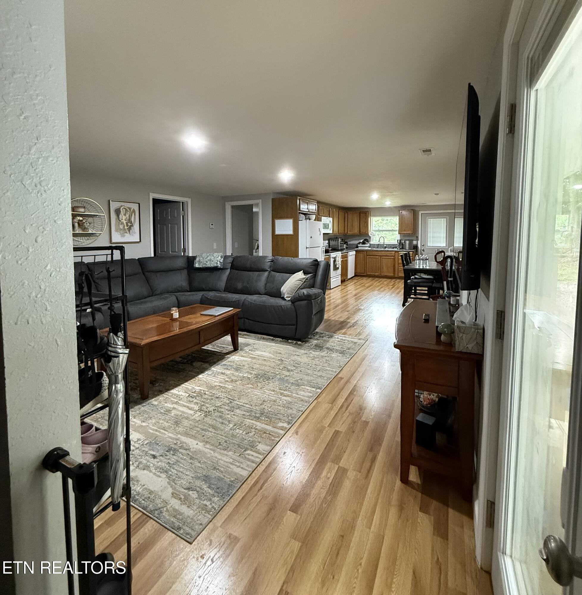 309 Hobson Road Kingston, TN 37763 - Photo 10 of 12 a living room with furniture and a wooden floor