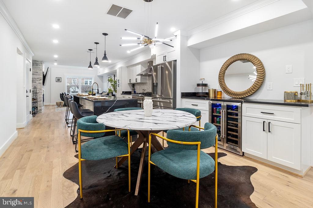 1242 Meigs Place Northeast, Unit 3 Washington, DC 20002 - Photo 6 of 13 a view of a dining room with furniture and wooden floor