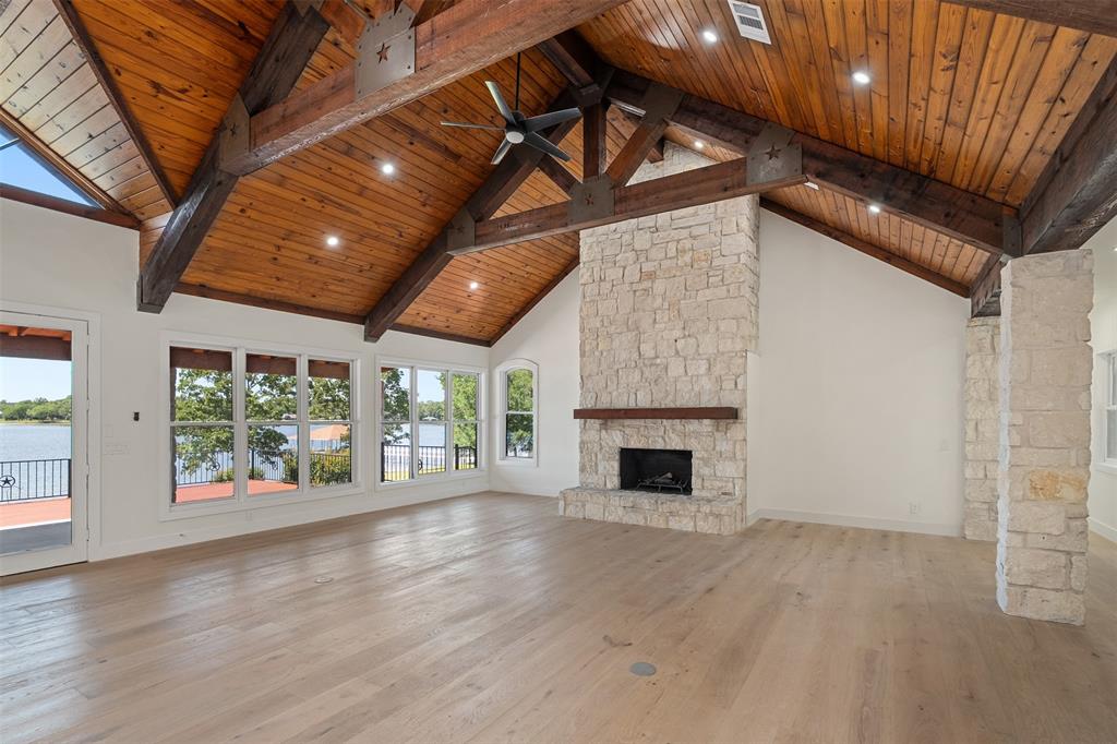 14354 Ridge Lane Malakoff, TX 75148 - Photo 7 of 40 an empty room with wooden floor fireplace and windows