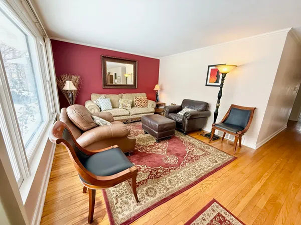 a living room with furniture and a rug
