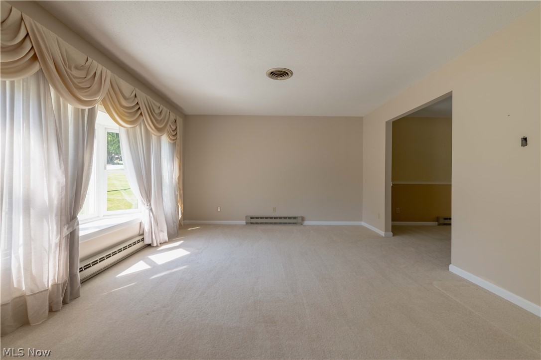 3963 Mark Road Cambridge, OH 43725 - Photo 14 of 50 Carpeted empty room featuring a baseboard radiator