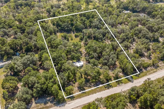 a view of a yard from a balcony