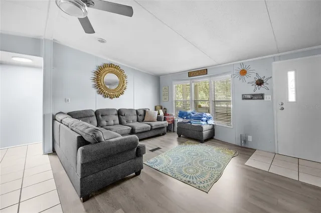 a living room with furniture and a window