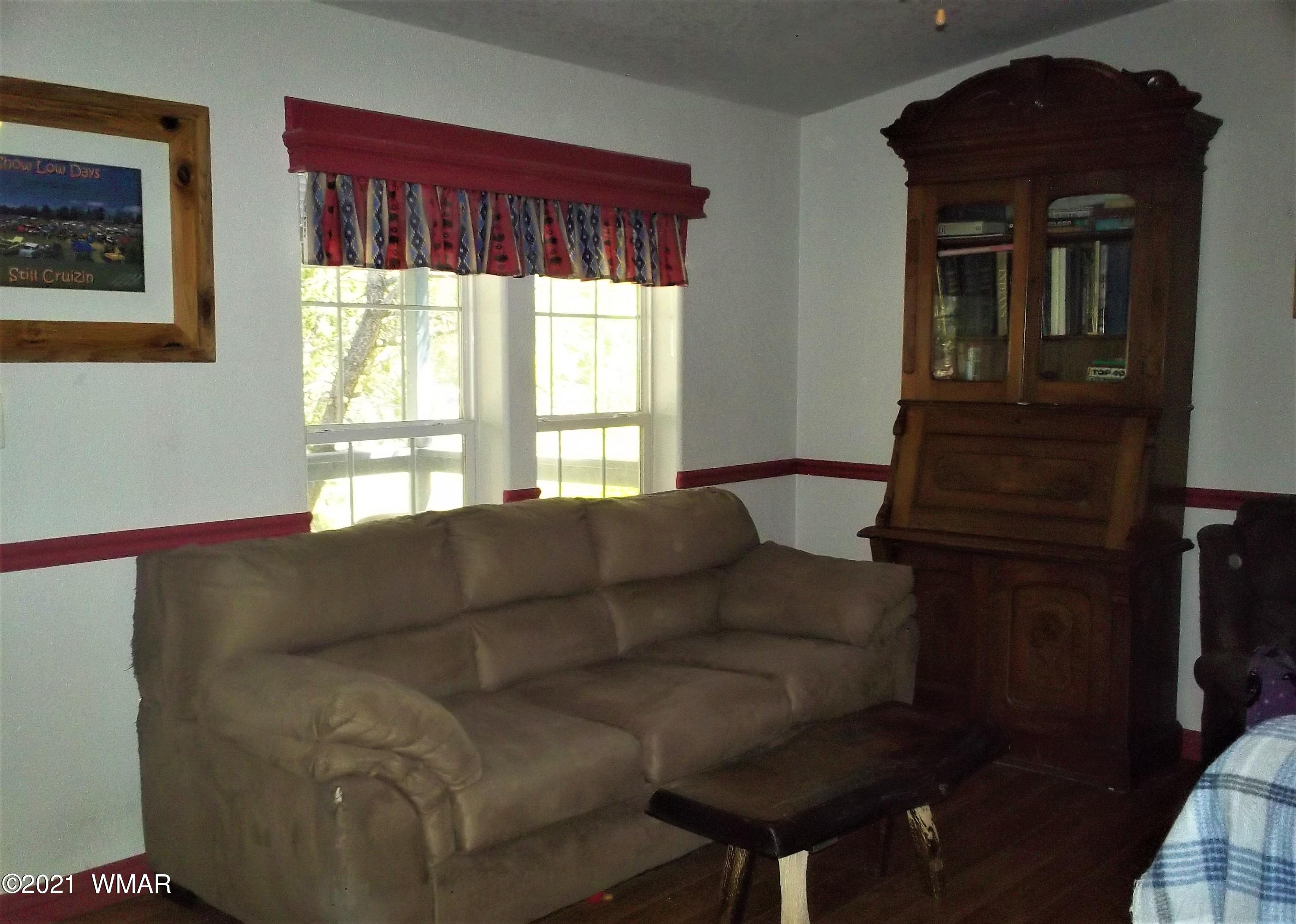 6 N3097 Vernon, AZ 85940 - Photo 15 of 40 a living room with furniture and a window