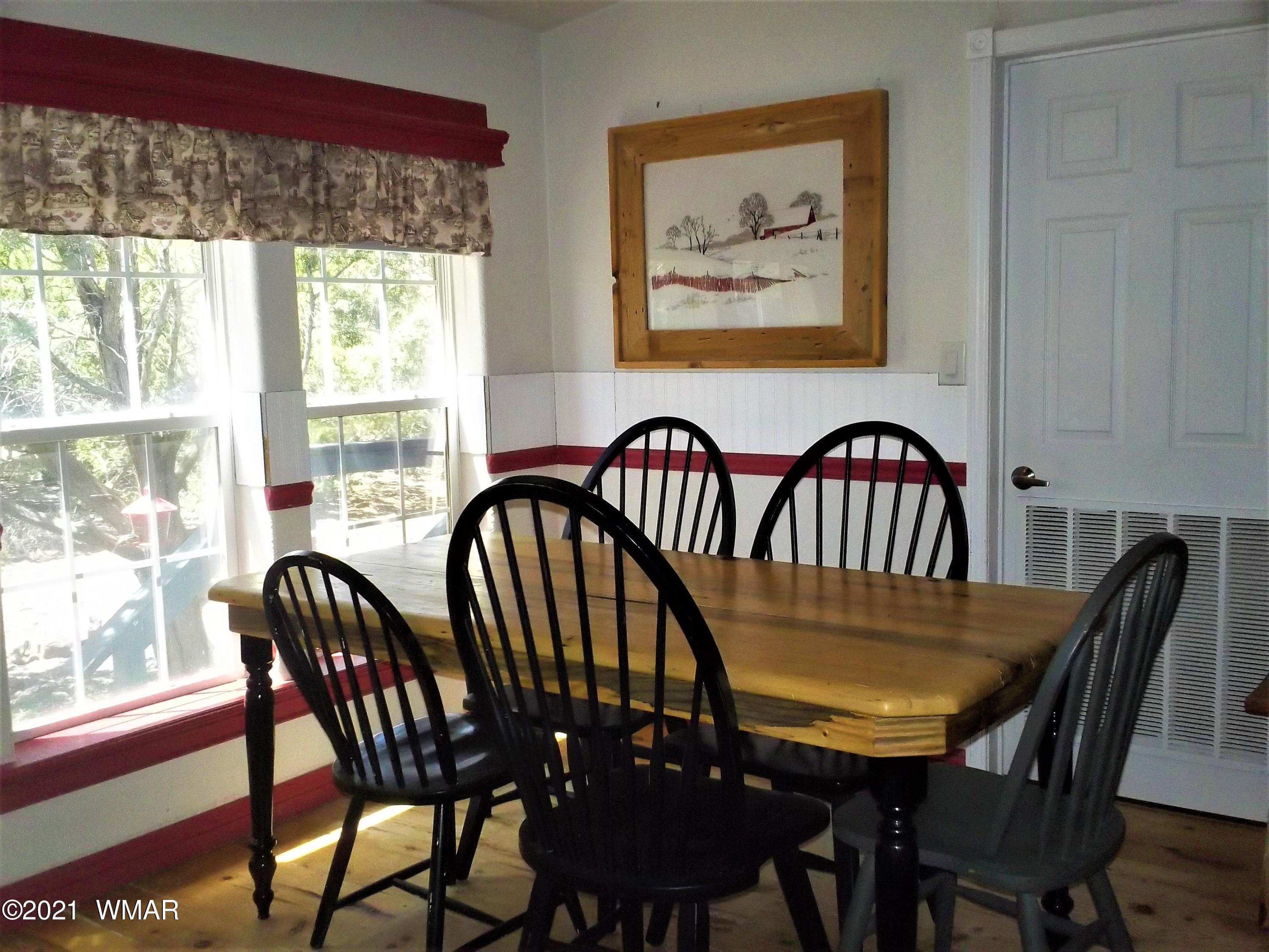 6 N3097 Vernon, AZ 85940 - Photo 21 of 40 a view of a dining room with furniture window and outside view