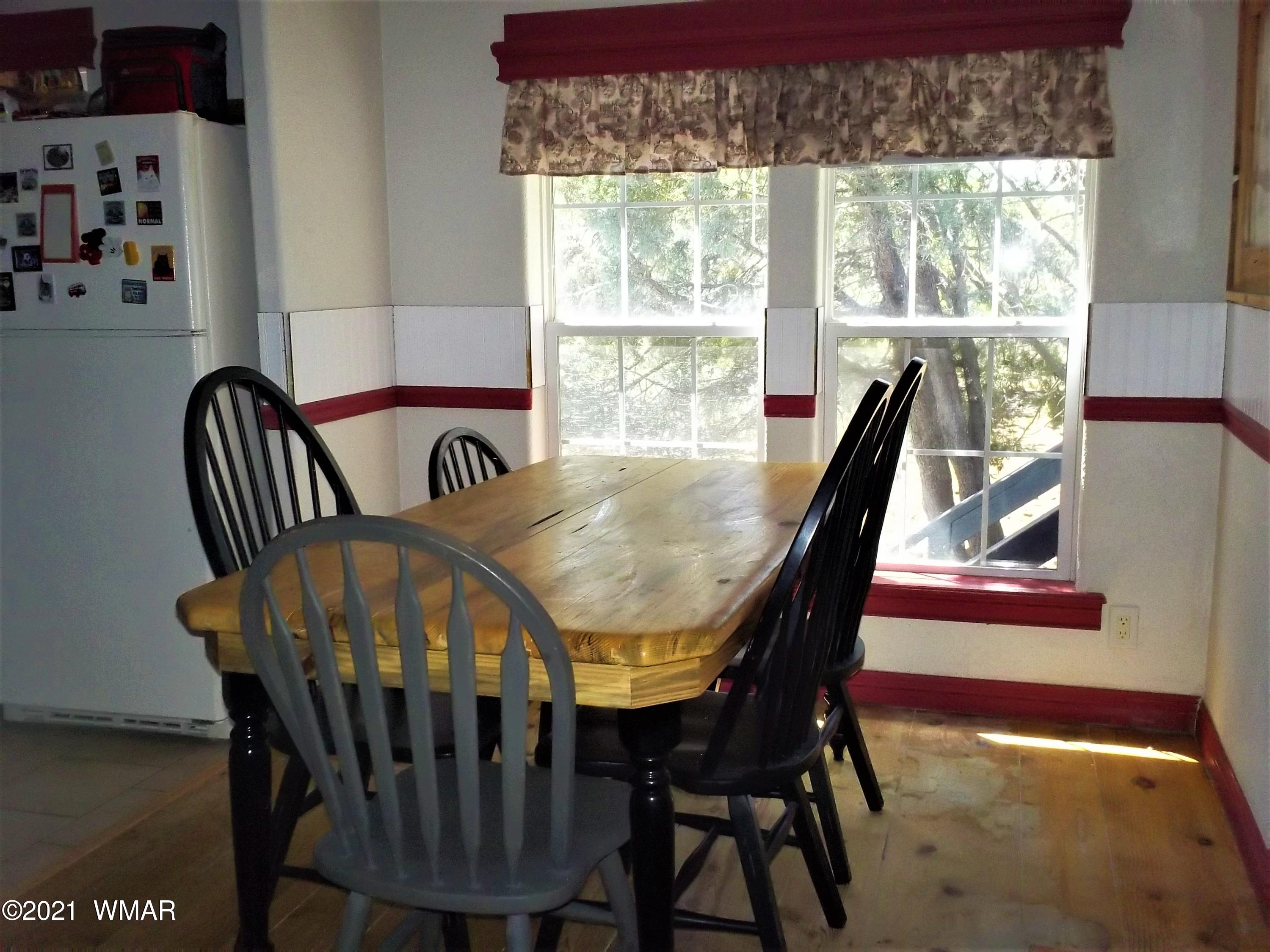 6 N3097 Vernon, AZ 85940 - Photo 22 of 40 a view of a dining room with furniture window and outside view