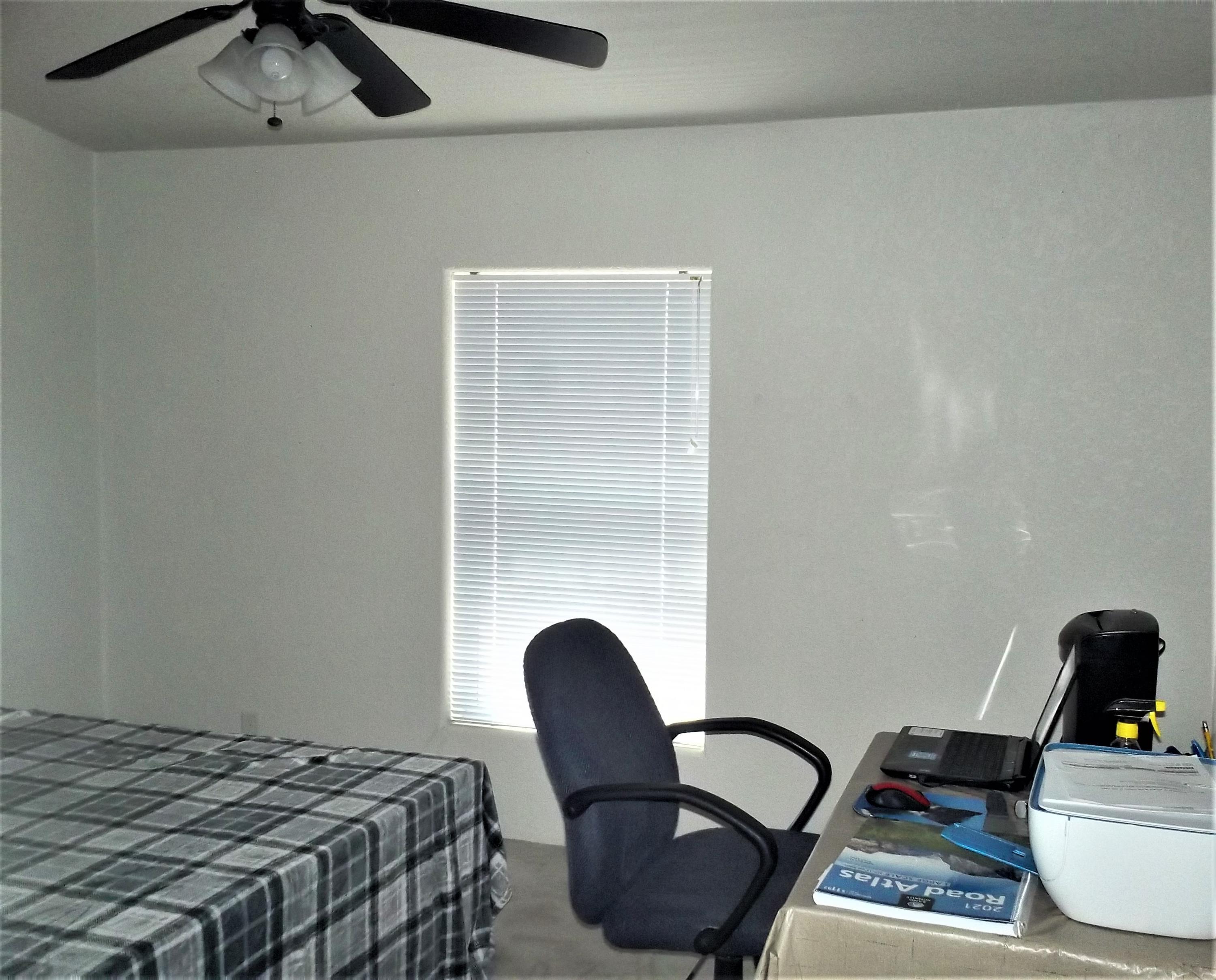 6 N3097 Vernon, AZ 85940 - Photo 31 of 40 a bedroom with a bed and a chair