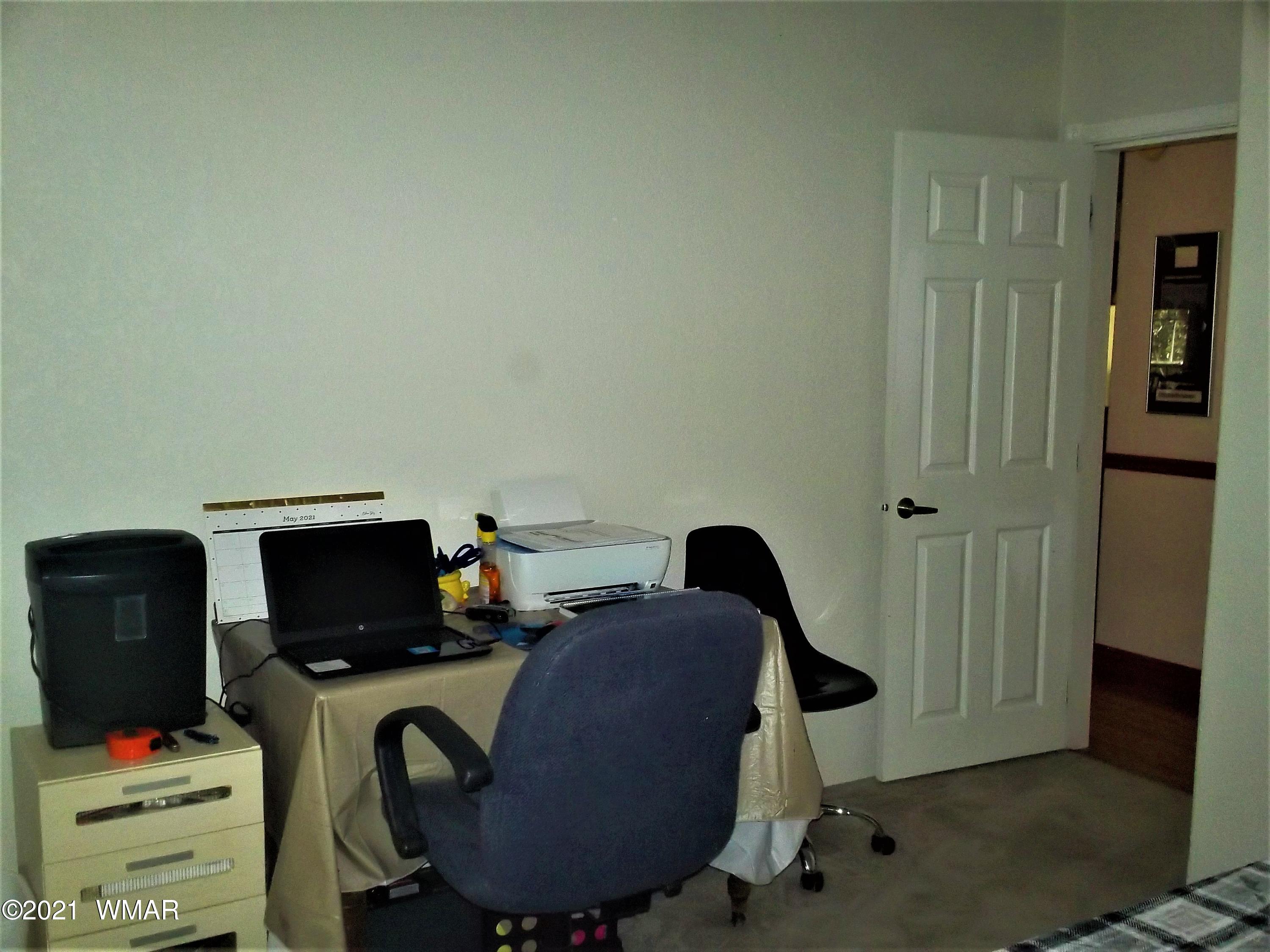 6 N3097 Vernon, AZ 85940 - Photo 32 of 40 a workspace with furniture and wooden floor