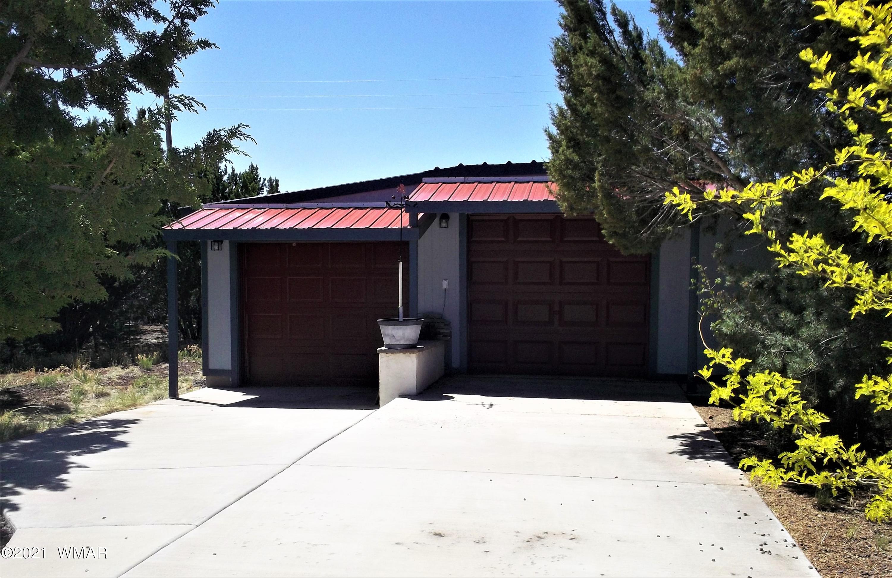 6 N3097 Vernon, AZ 85940 - Photo 36 of 40 a front view of a house with a yard
