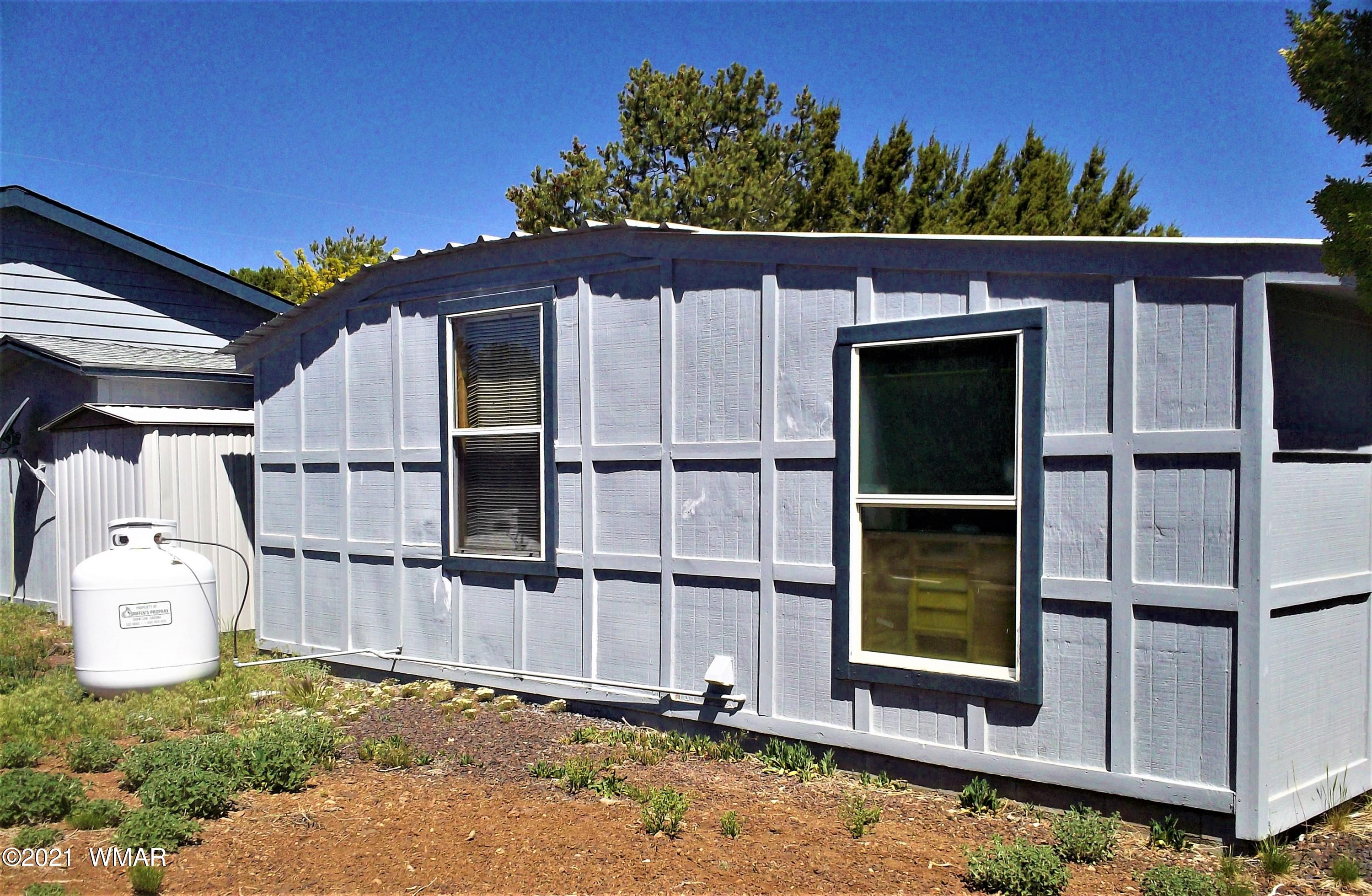 6 N3097 Vernon, AZ 85940 - Photo 38 of 40 front view of a house with a small yard