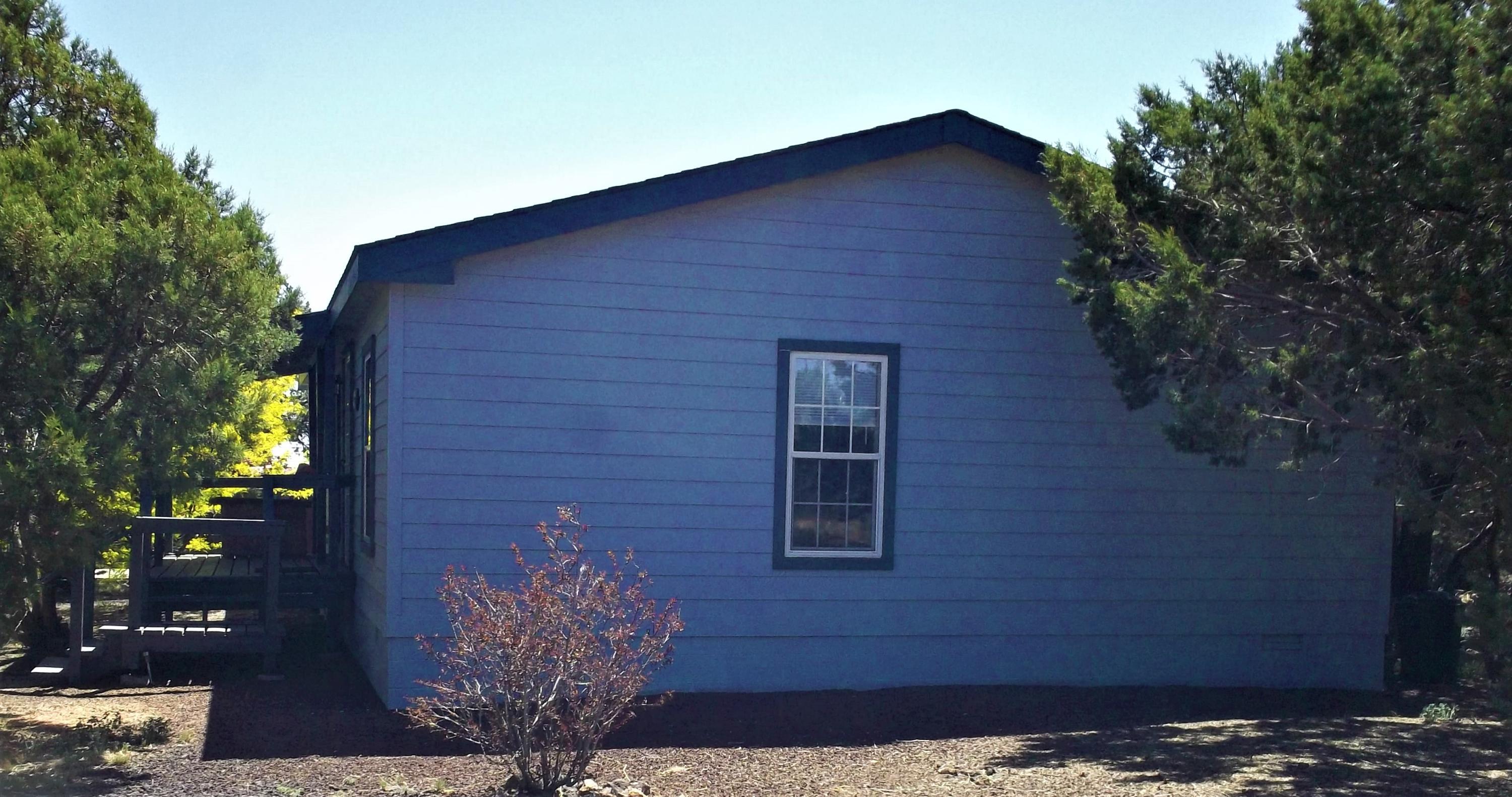 6 N3097 Vernon, AZ 85940 - Photo 10 of 40 a brick building with a tree in front of it