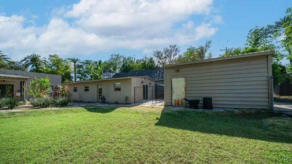 a view of backyard with green space