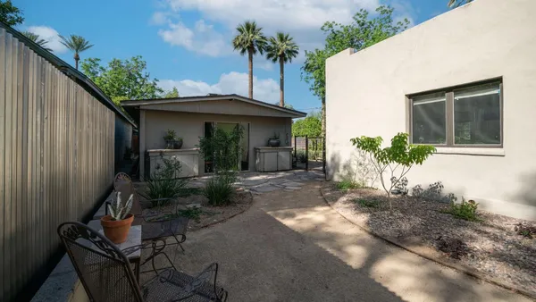 a view of a house with a small yard