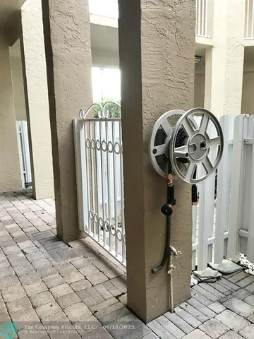a view of a door with wooden floor and a window
