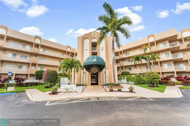 a view of a building with a garden and plants