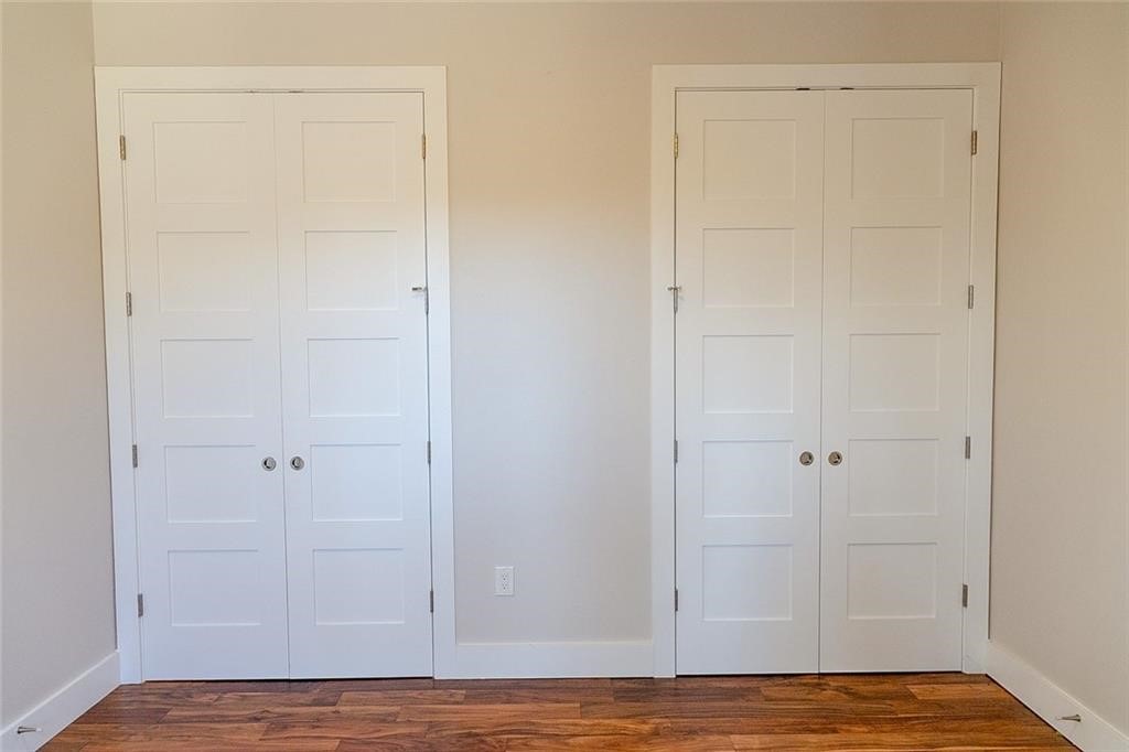 2509 Del Curto Road, Unit A Austin, TX 78704 - Photo 12 of 23 an empty room with wooden floor and closet