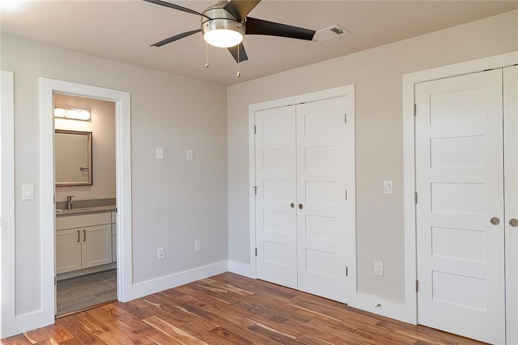 2509 Del Curto Road, Unit A Austin, TX 78704 - Photo 13 of 23 wooden floor in an empty room with a window