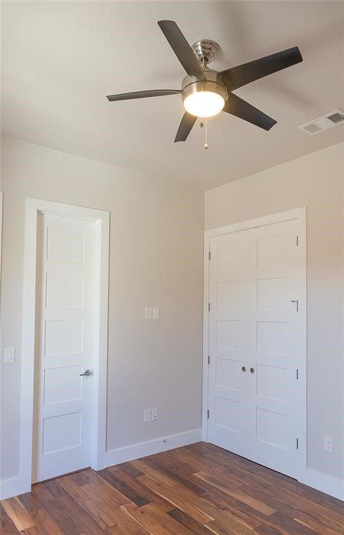 2509 Del Curto Road, Unit A Austin, TX 78704 - Photo 17 of 23 a view of a livingroom with wooden floor and a ceiling fan