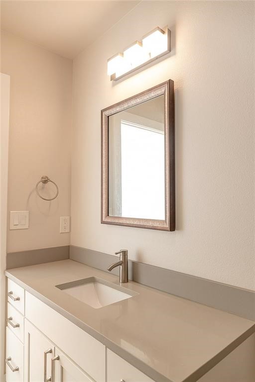 2509 Del Curto Road, Unit A Austin, TX 78704 - Photo 19 of 23 a bathroom with a sink a vanity and a mirror