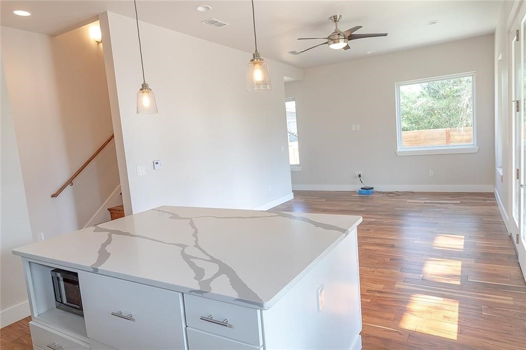 2509 Del Curto Road, Unit A Austin, TX 78704 - Photo 8 of 23 a bathroom with a sink a large mirror and vanity