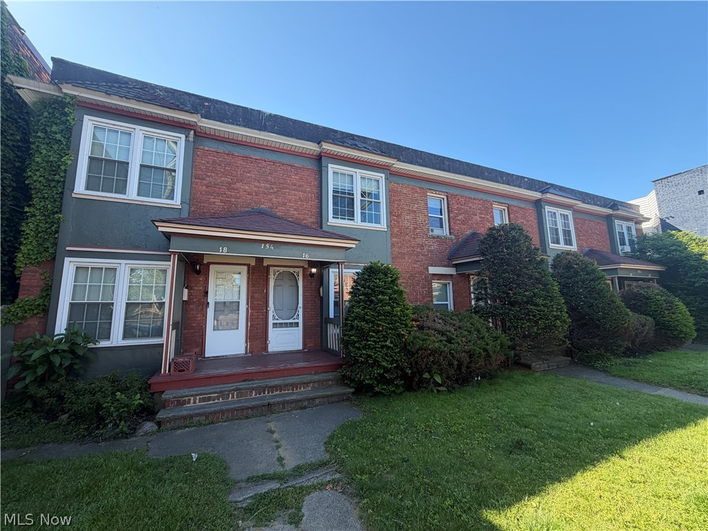 15416 Waterloo Road Cleveland, OH 44110 - Photo 18 of 18 Brick and stucco exterior with multiple entryways