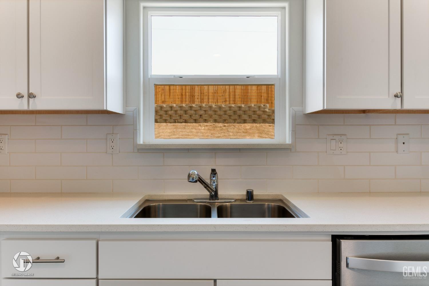 Undisclosed Address Shafter, CA 93263 - Photo 16 of 33 a kitchen with a sink and a window