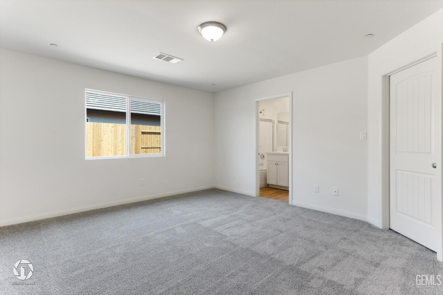 Undisclosed Address Shafter, CA 93263 - Photo 19 of 33 an empty room with a window and a kitchen