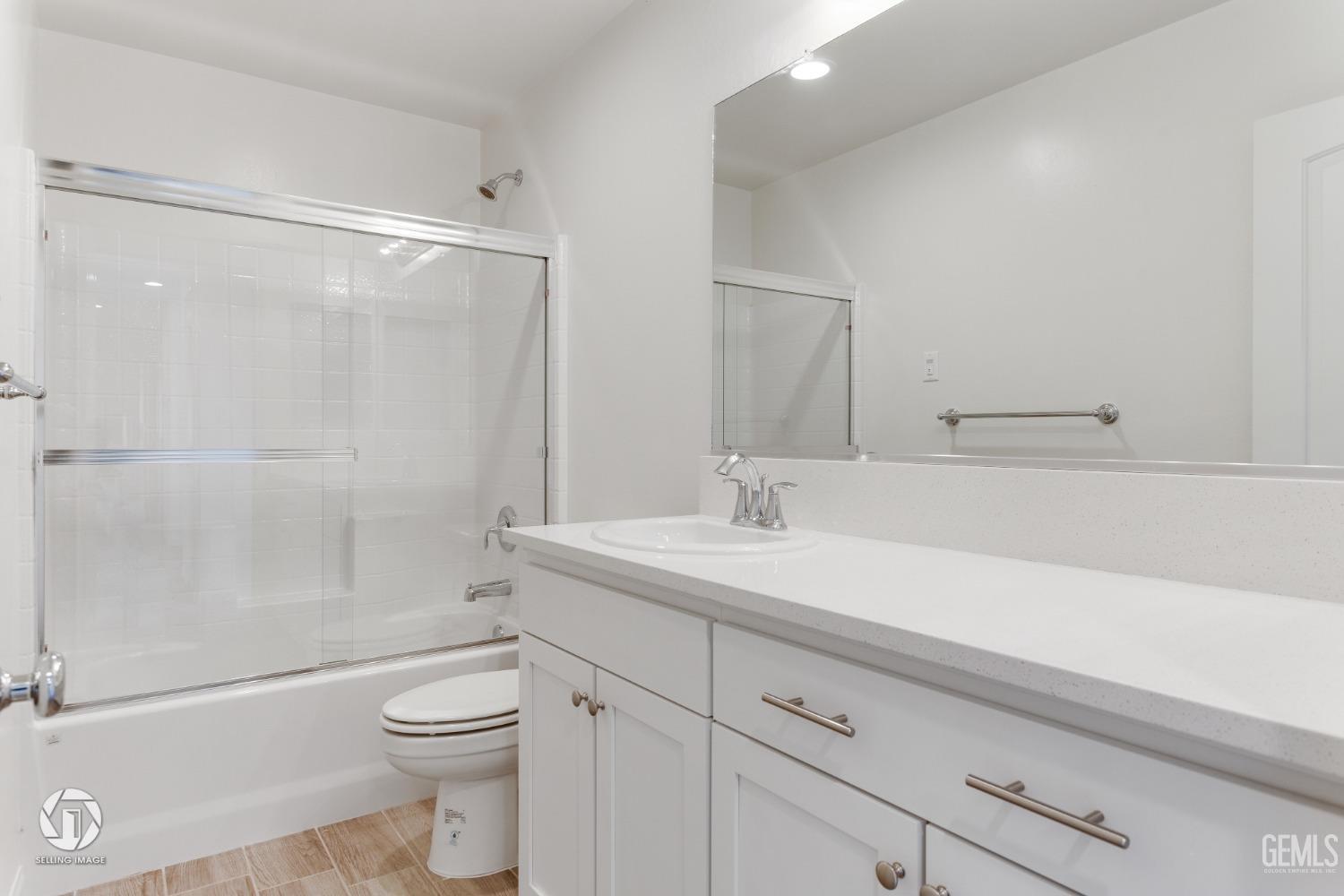 Undisclosed Address Shafter, CA 93263 - Photo 27 of 33 a bathroom with a sink a toilet and shower