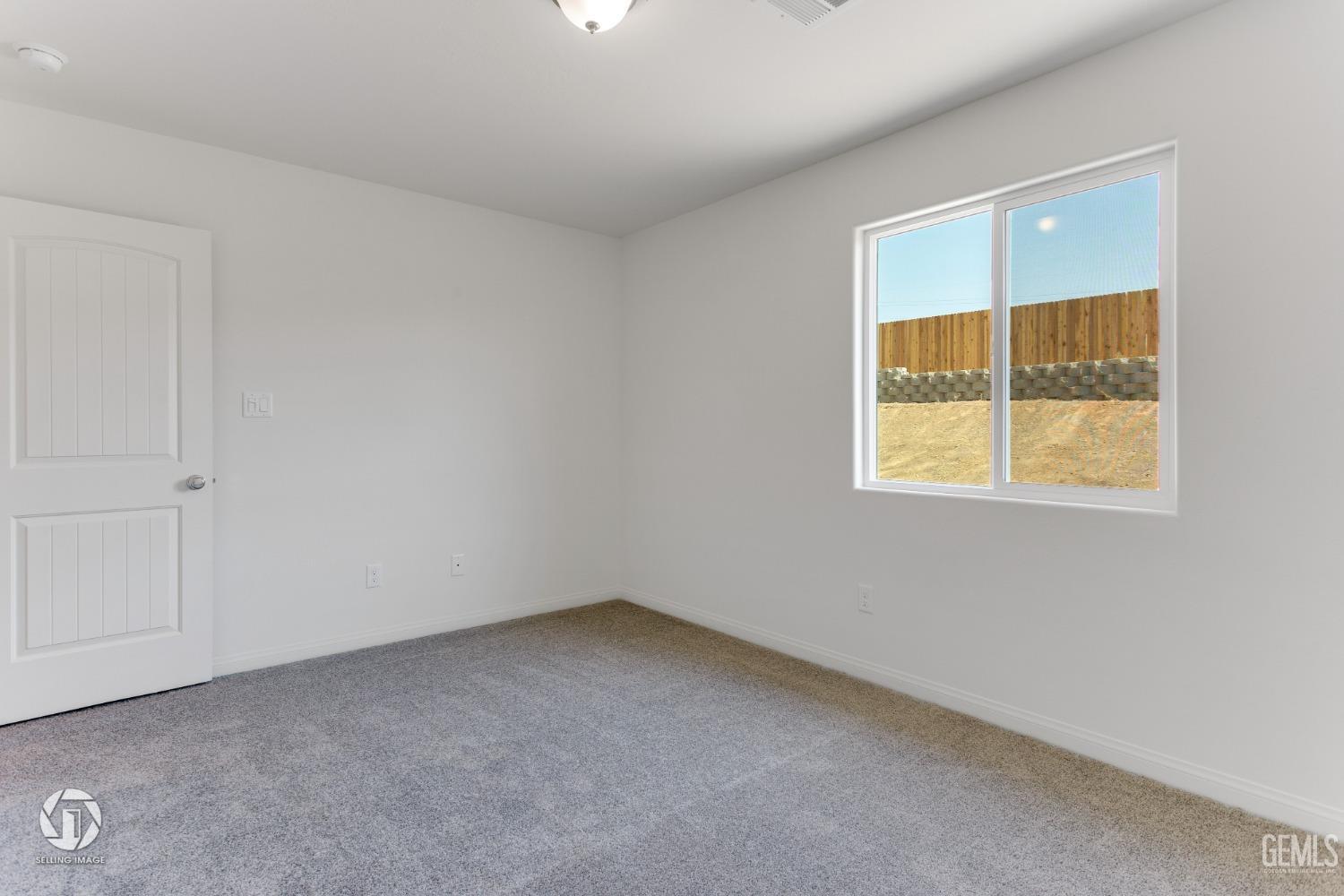 Undisclosed Address Shafter, CA 93263 - Photo 30 of 33 an empty room with a window