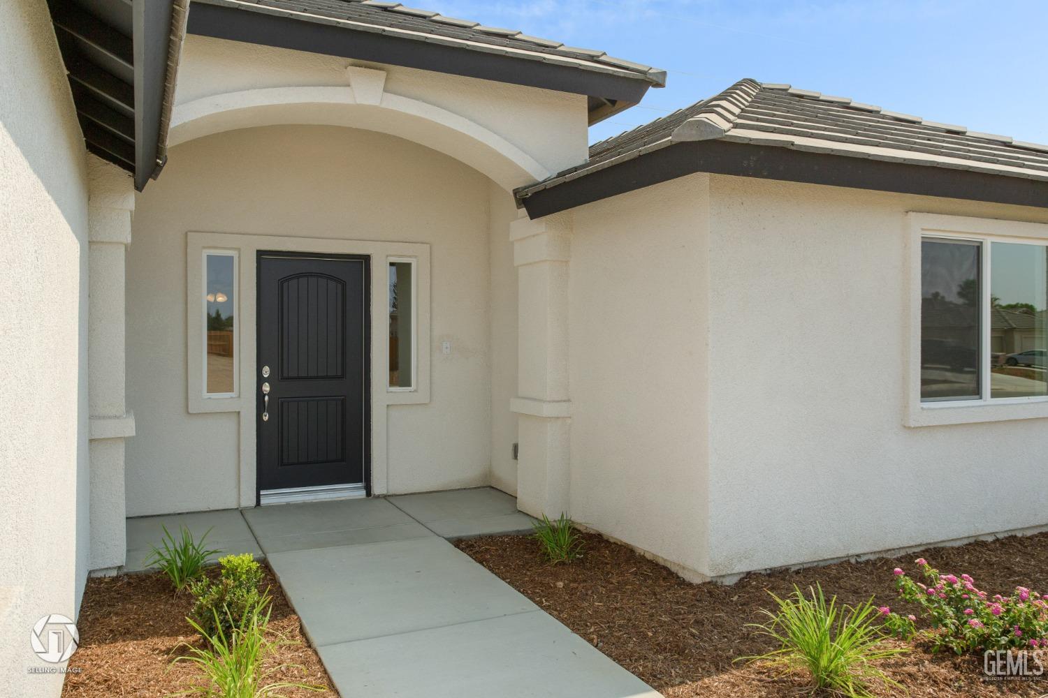 Undisclosed Address Shafter, CA 93263 - Photo 4 of 33 a view of a front door and a window