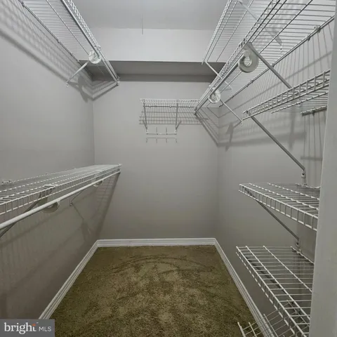 a view of a room with racks on the wall