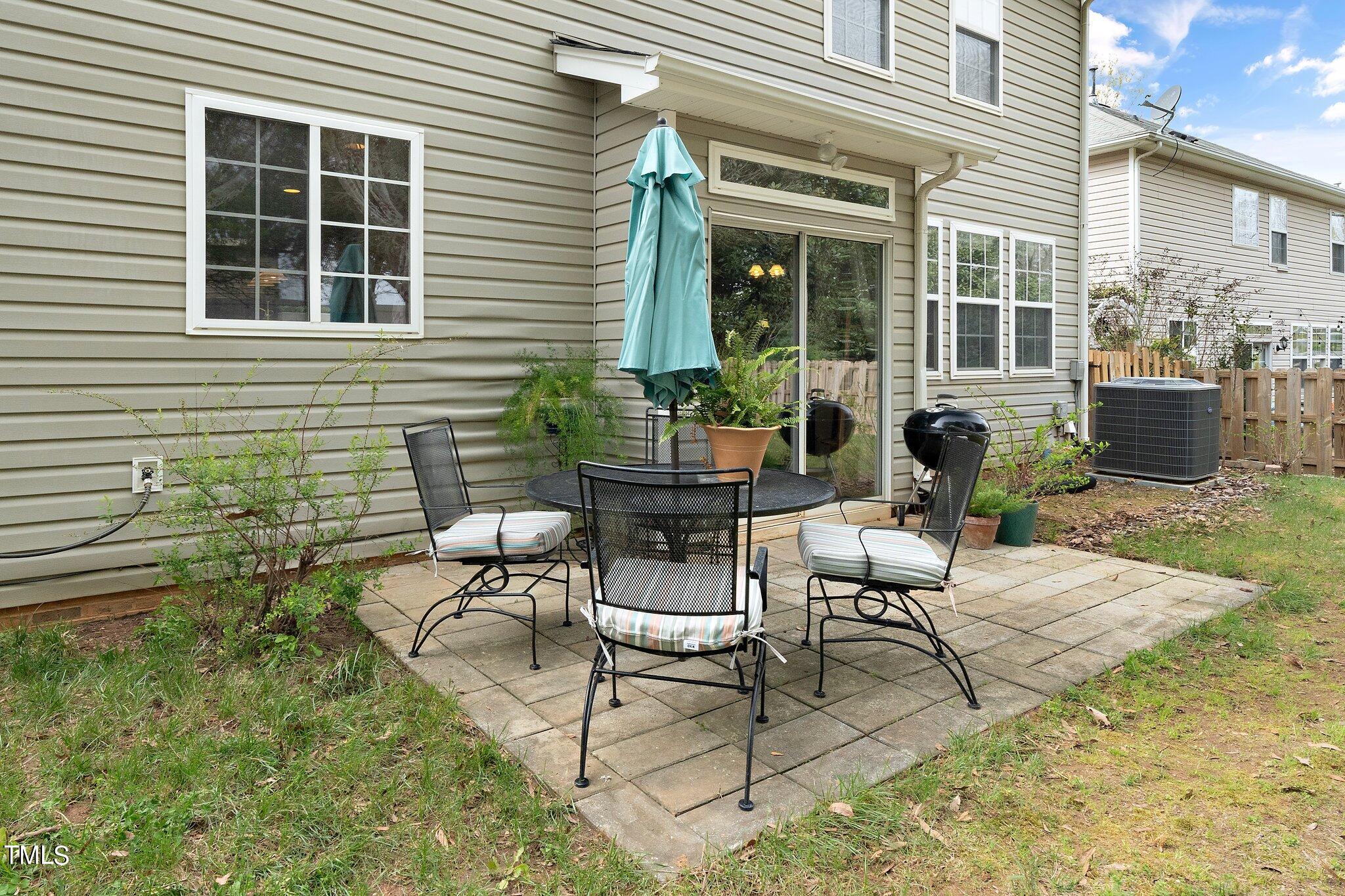 120 Solheim Lane Raleigh, NC 27603 - Photo 23 of 26 a view of a house with backyard sitting area and garden