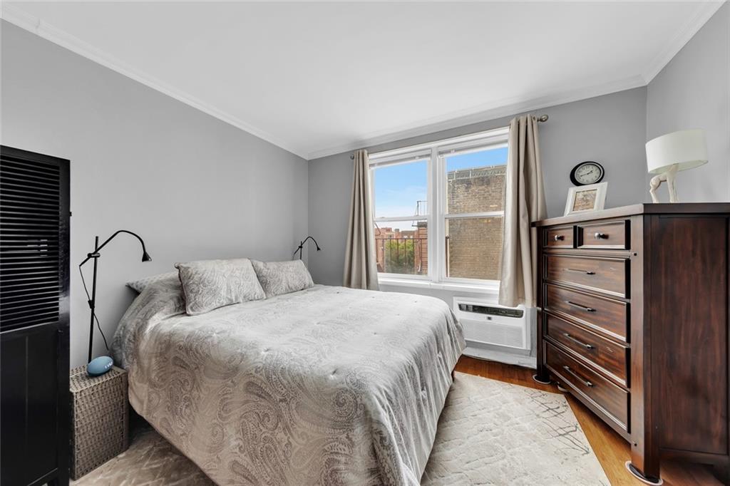 9201 Shore Road, Unit C701 Brooklyn, NY 11209 - Photo 3 of 9 a bedroom with a bed and a closet