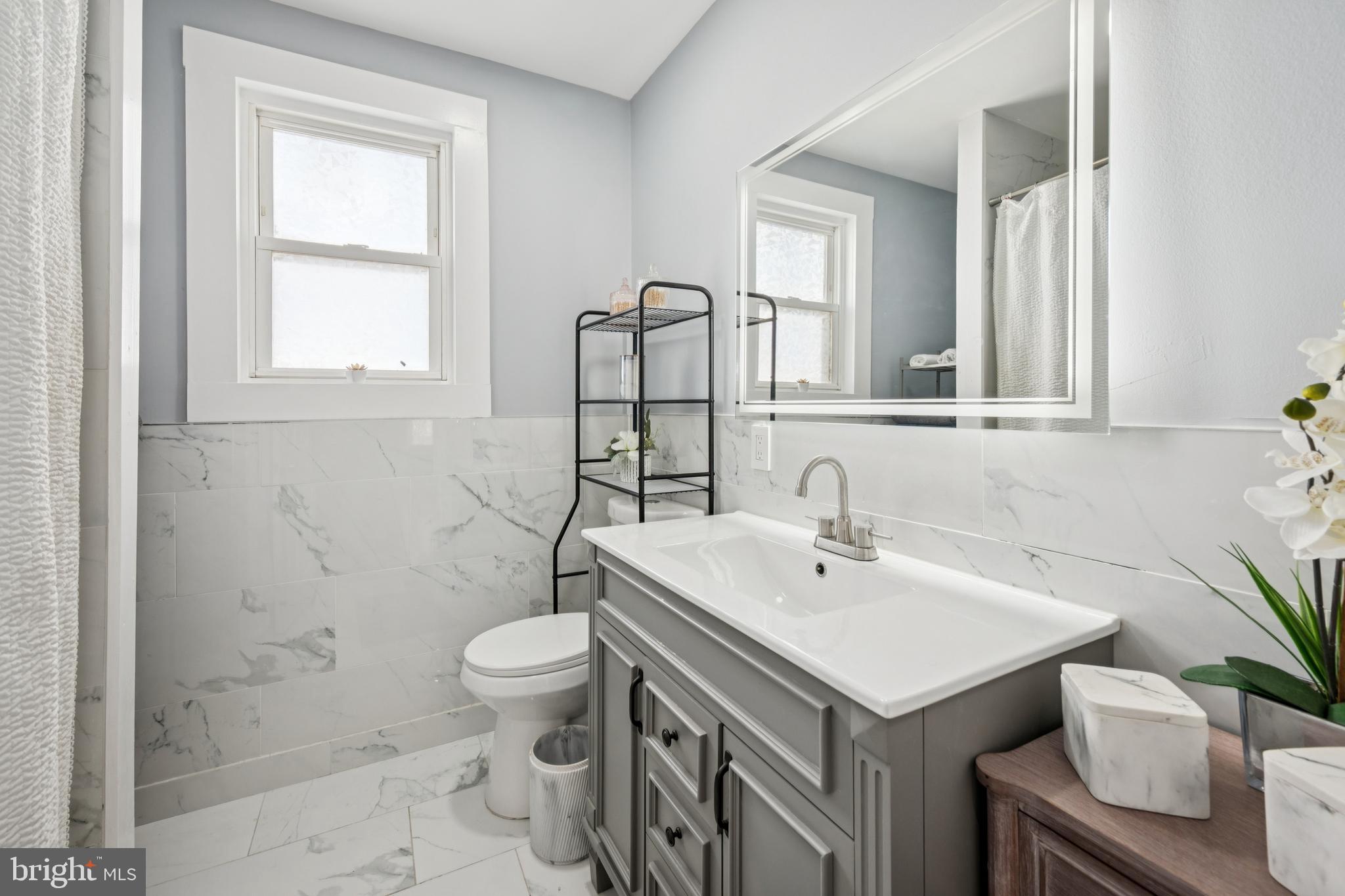 259 Hooker Street Riverside, NJ 08075 - Photo 17 of 25 a bathroom with a sink a toilet and shower
