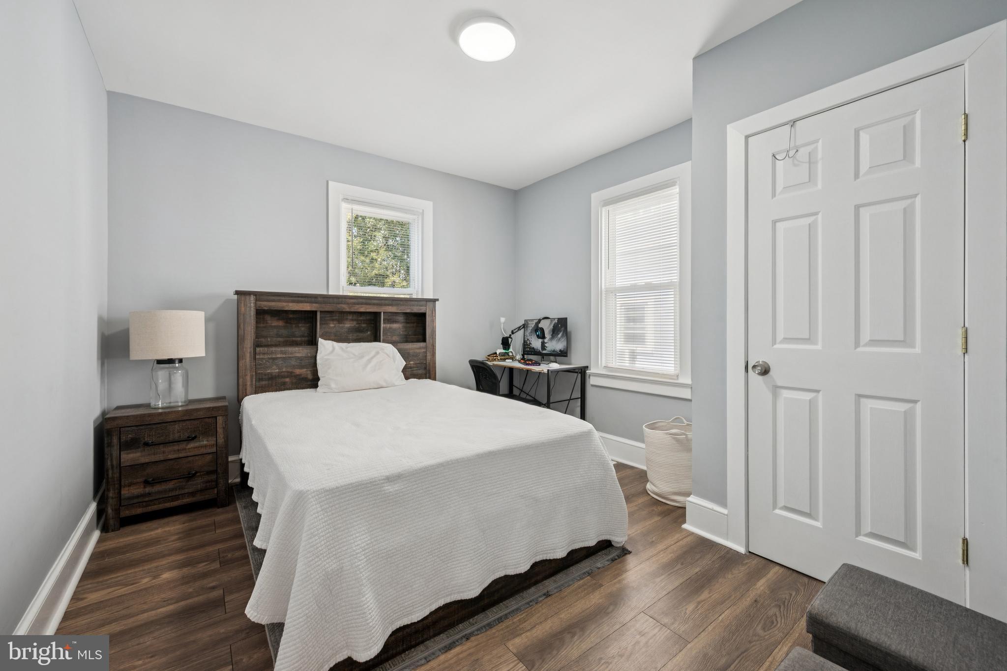 259 Hooker Street Riverside, NJ 08075 - Photo 19 of 25 a bedroom with a bed and wooden floor